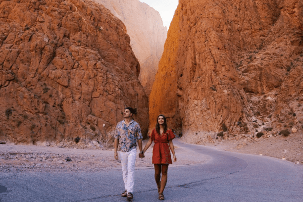 Couple walking through the spectacular Todra Gorge canyon in Morocco during a private Morocco tour.