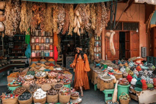 Traditional Moroccan spice market in Marrakech Medina with colorful spices, herbs, and local handicrafts.