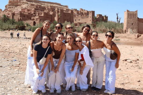 Group of travelers visiting Ait Ben Haddou Kasbah in Morocco