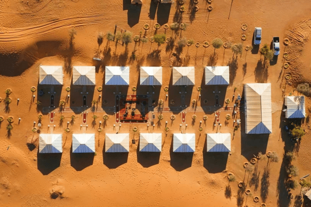Luxury desert camp surrounded by Sahara dunes in Merzouga Morocco